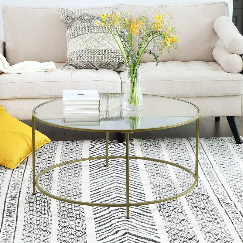 Sofabord i guld farve med glastop